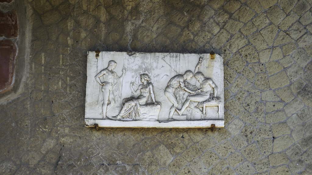 Ins. Orientalis I, 2, Herculaneum, August 2021.
Plaque now on south wall of atrium, originally from one of the rear rooms. Photo courtesy of Robert Hanson.